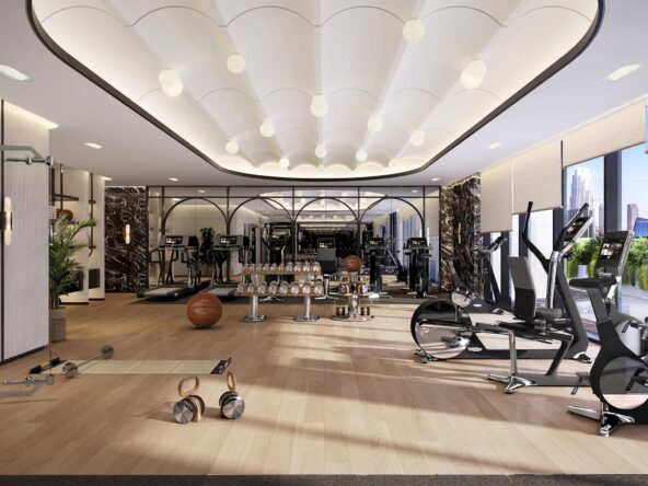 A modern and luxurious gym with a variety of cardio and strength training equipment at dubai downtown