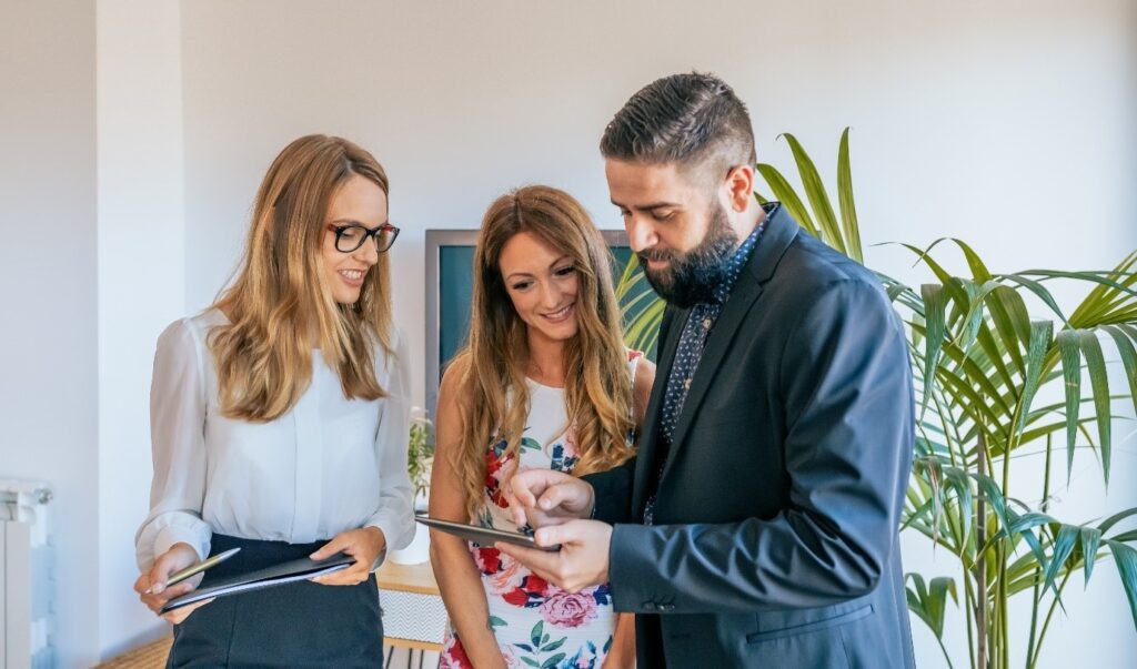 Real estate agents, showing property to buyers in dubai