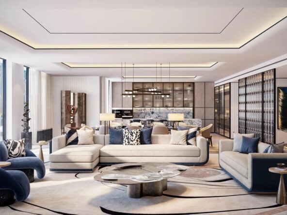 A spacious and luxurious living room with a modern design. The room features a large L-shaped sofa with blue and white cushions, two armchairs, and a coffee table.