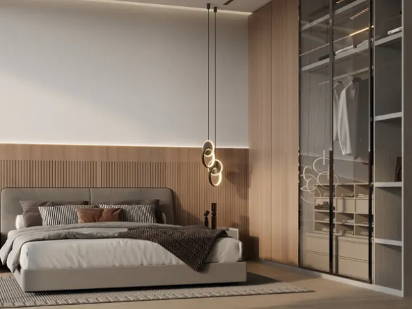 Modern bedroom interior design featuring a neutral color palette, a king-size bed with soft linens, a walk-in wardrobe with glass sliding doors, and stylish pendant lights.