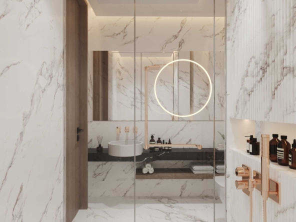 Modern Bathroom with Marble Walls and Gold Fixtures