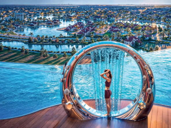 Woman enjoying a luxurious rooftop infinity pool with a stunning cityscape view at Danube Diamondz, JLT, Dubai.